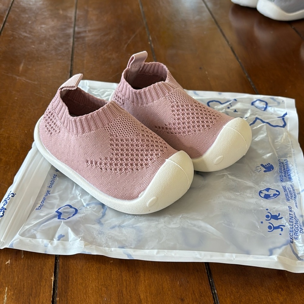 Pompon slip on baby shoes